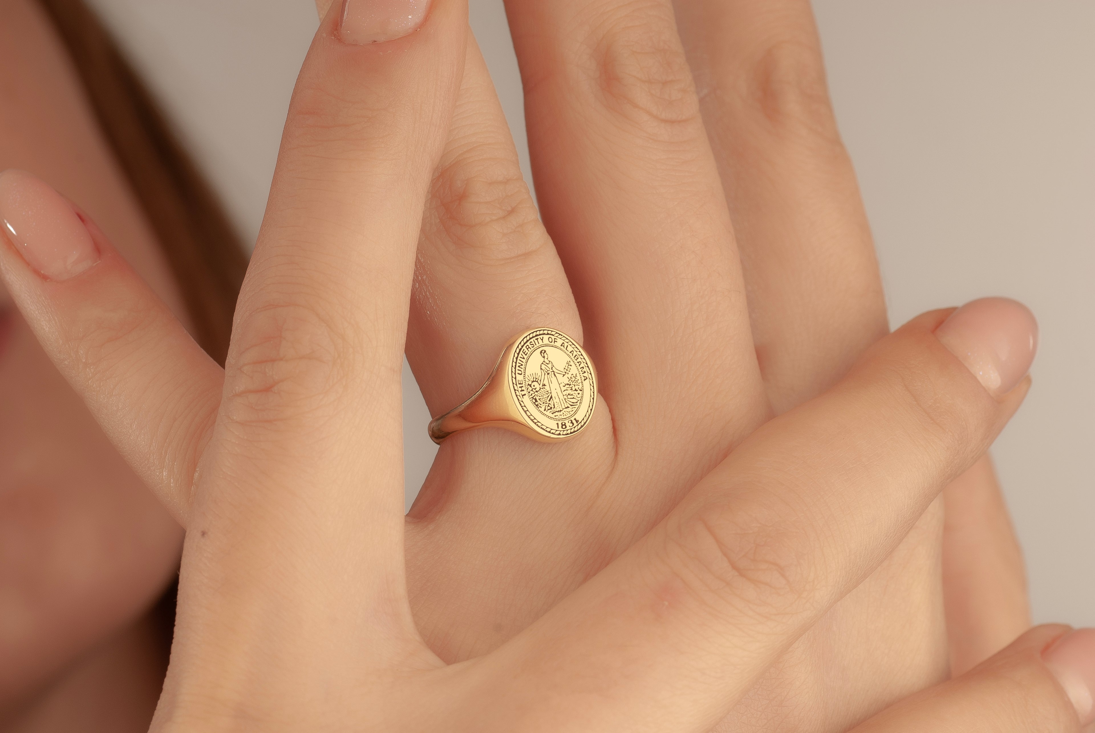 Ten by twelve millimeter oval graduation ring face size