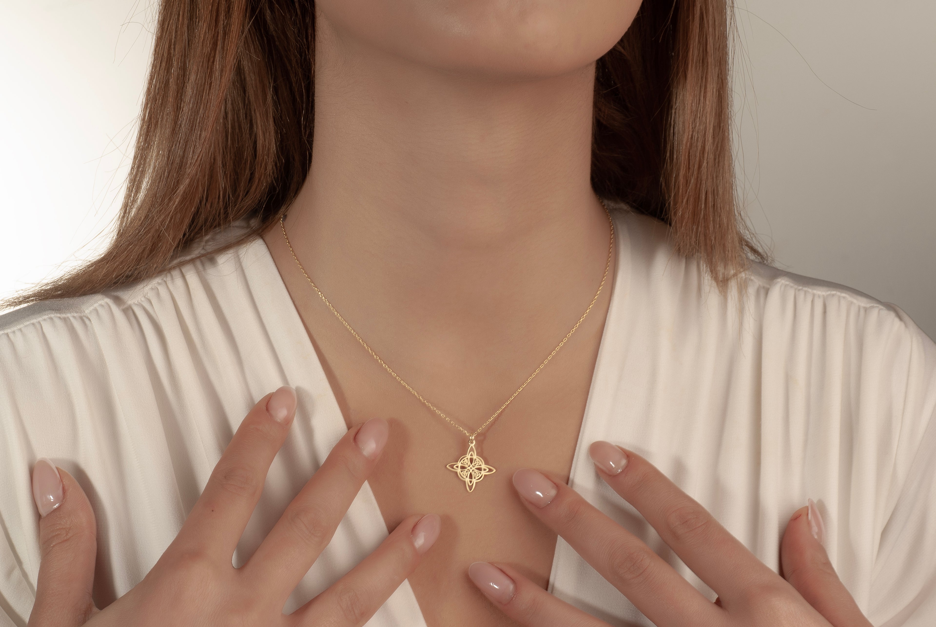 Celtic knot pendant necklace in solid white gold