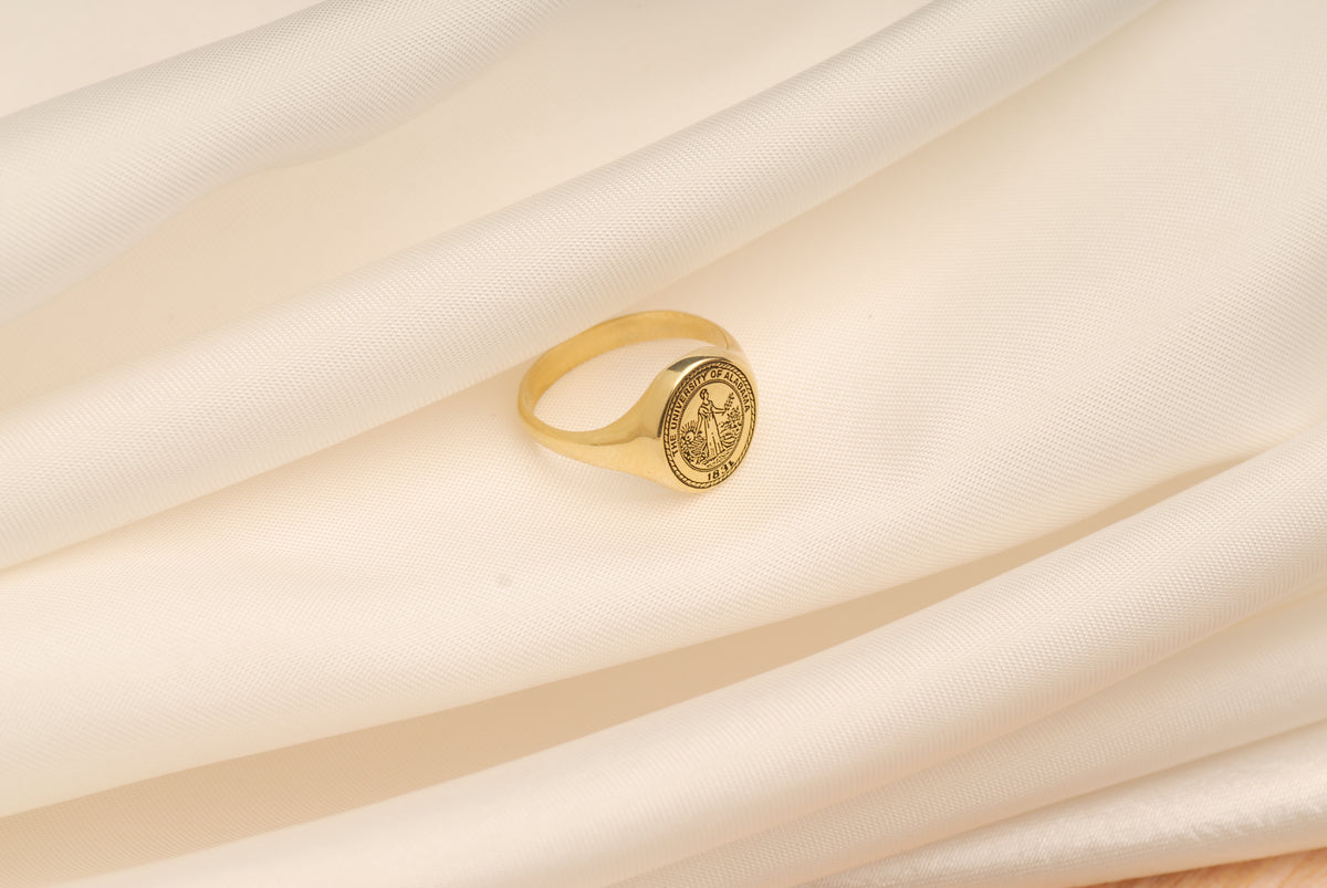 Personalized graduation class ring worn on hand