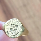 School logo engraved class ring in yellow gold