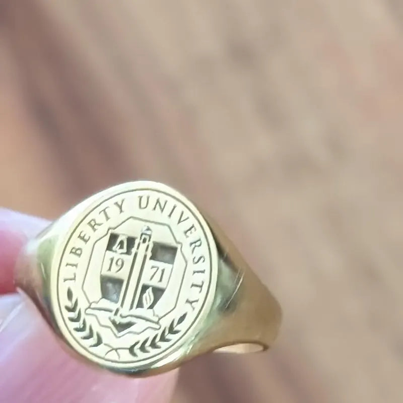 School logo engraved class ring in yellow gold