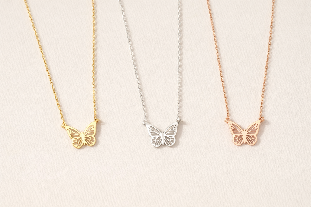 Butterfly necklace shown in gold white and rose colors