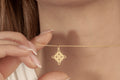 Gold Celtic knot necklace with a delicate cable chain