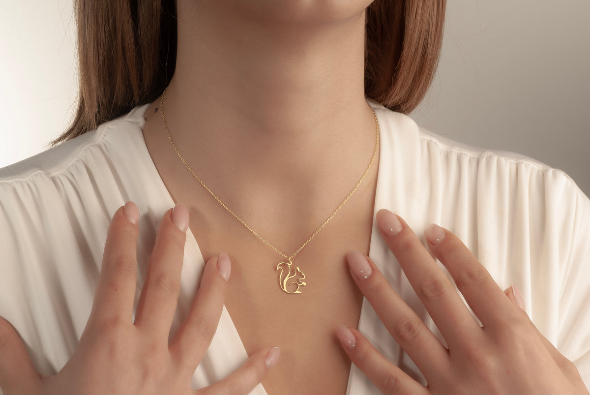 Brass sterling silver and solid gold squirrel necklace materials