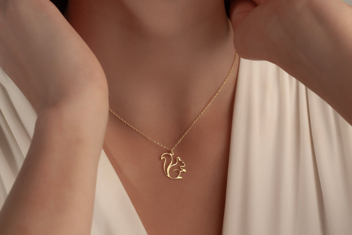 Delicate chain and pendant connection on squirrel necklace