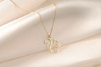 Close-up of an openwork gold squirrel pendant