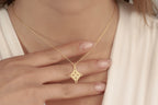 Dainty Celtic knot necklace worn by a woman