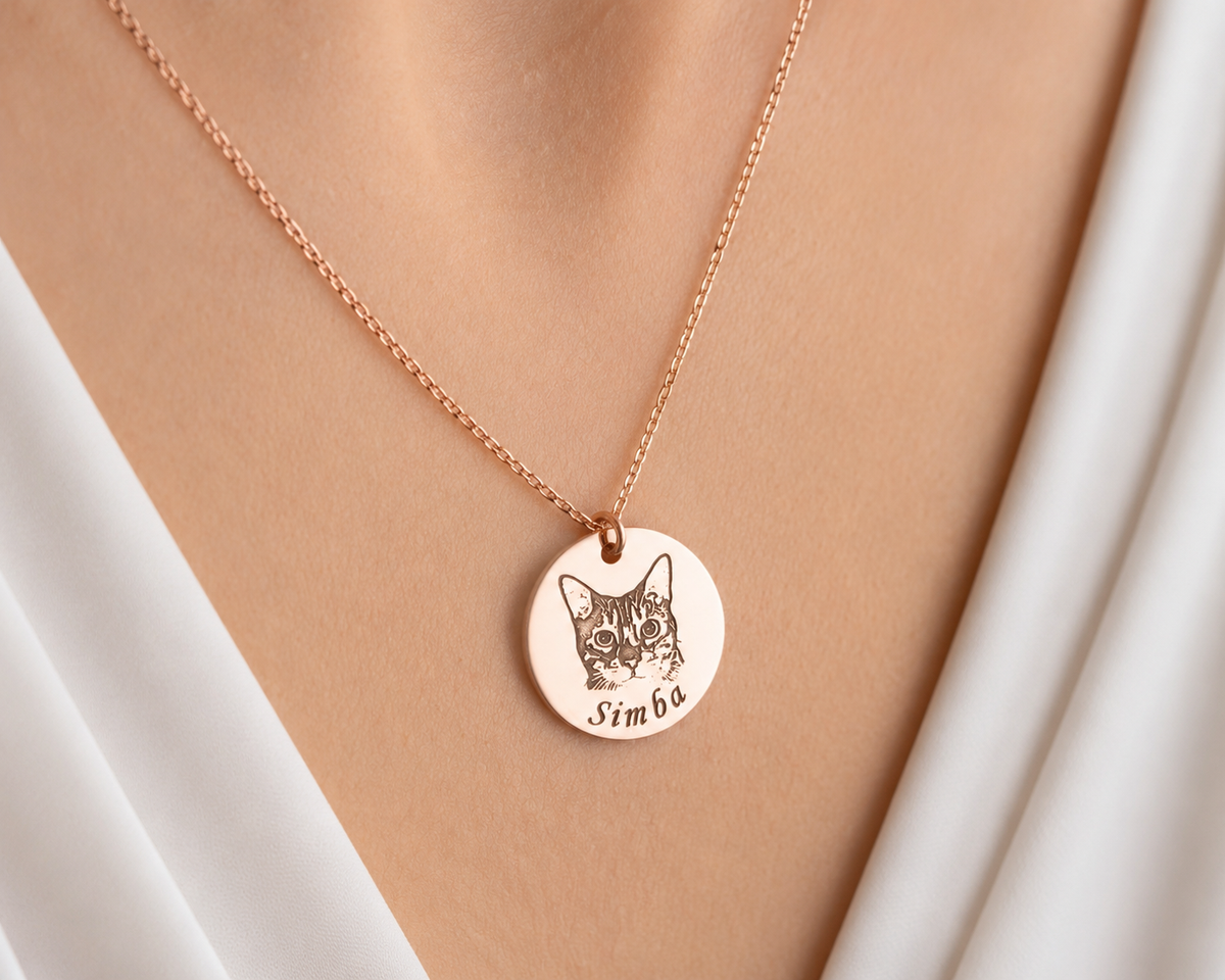 Personalized pet photo necklace with an engraved dog portrait and name