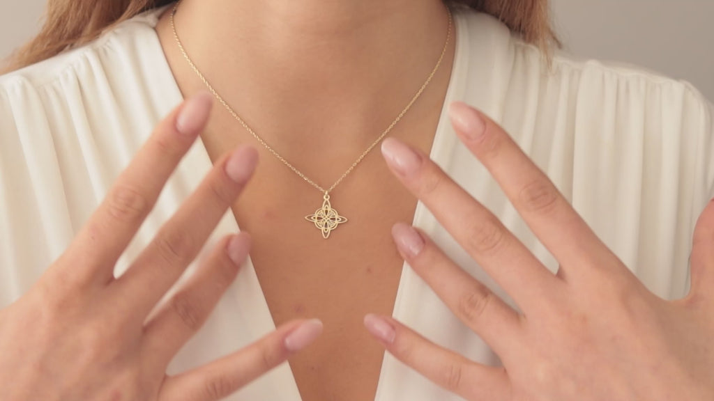 Dainty Celtic knot necklace worn by a woman