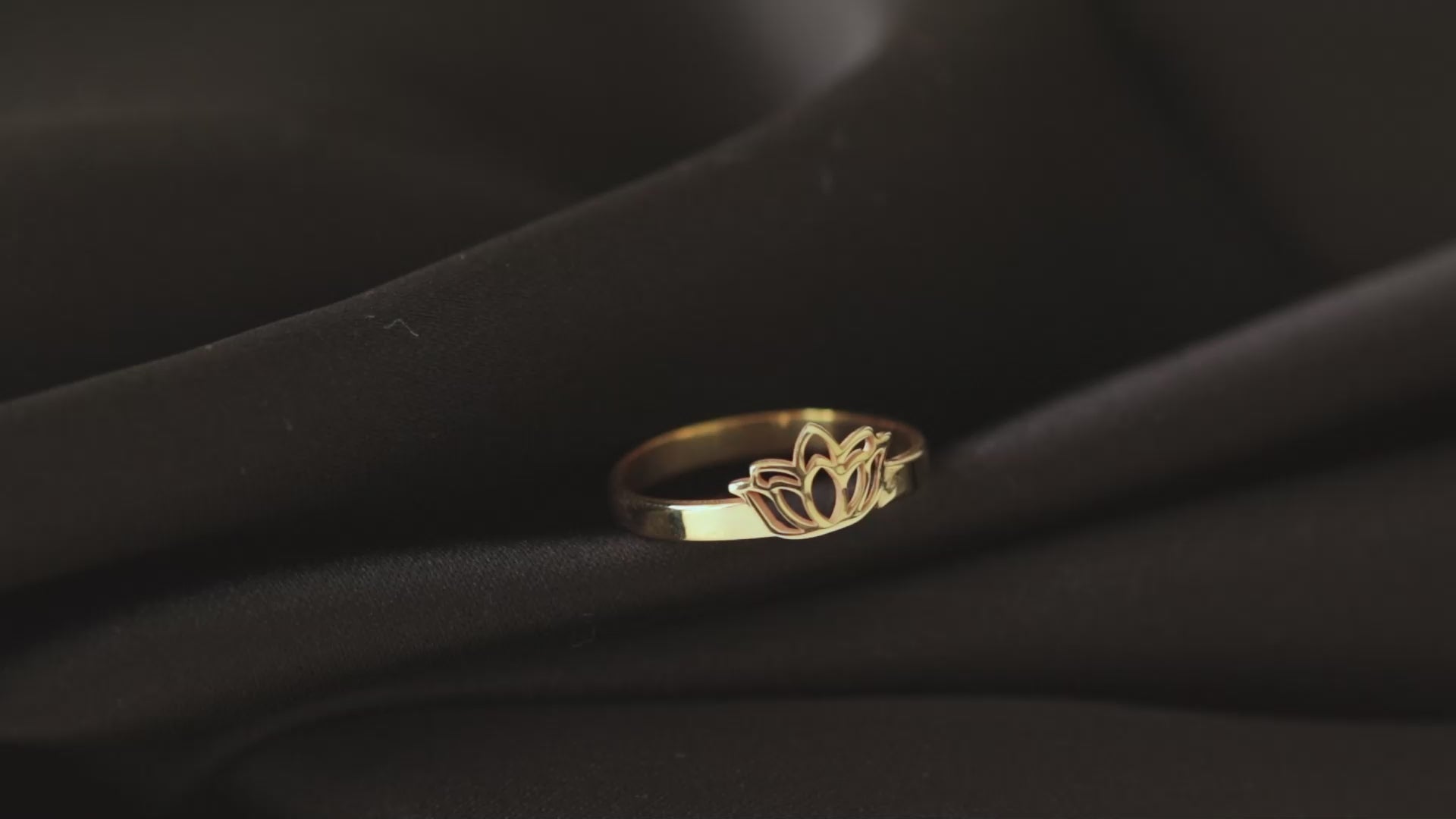 Dainty lotus flower ring worn on hand