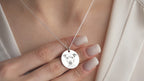 Original dog photo beside the finished custom pet portrait necklace