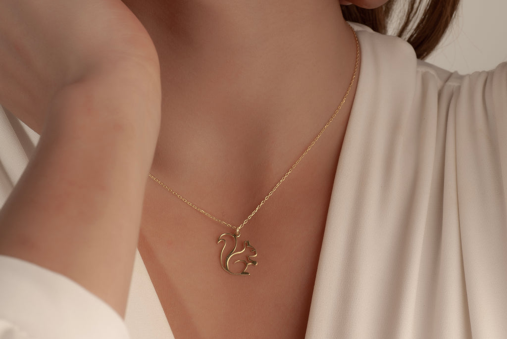 Delicate chain and pendant connection on squirrel necklace
