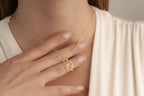 Gold squirrel pendant necklace worn by a woman